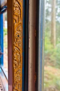 Wood carving on carriage of Nilgiri mountain railway